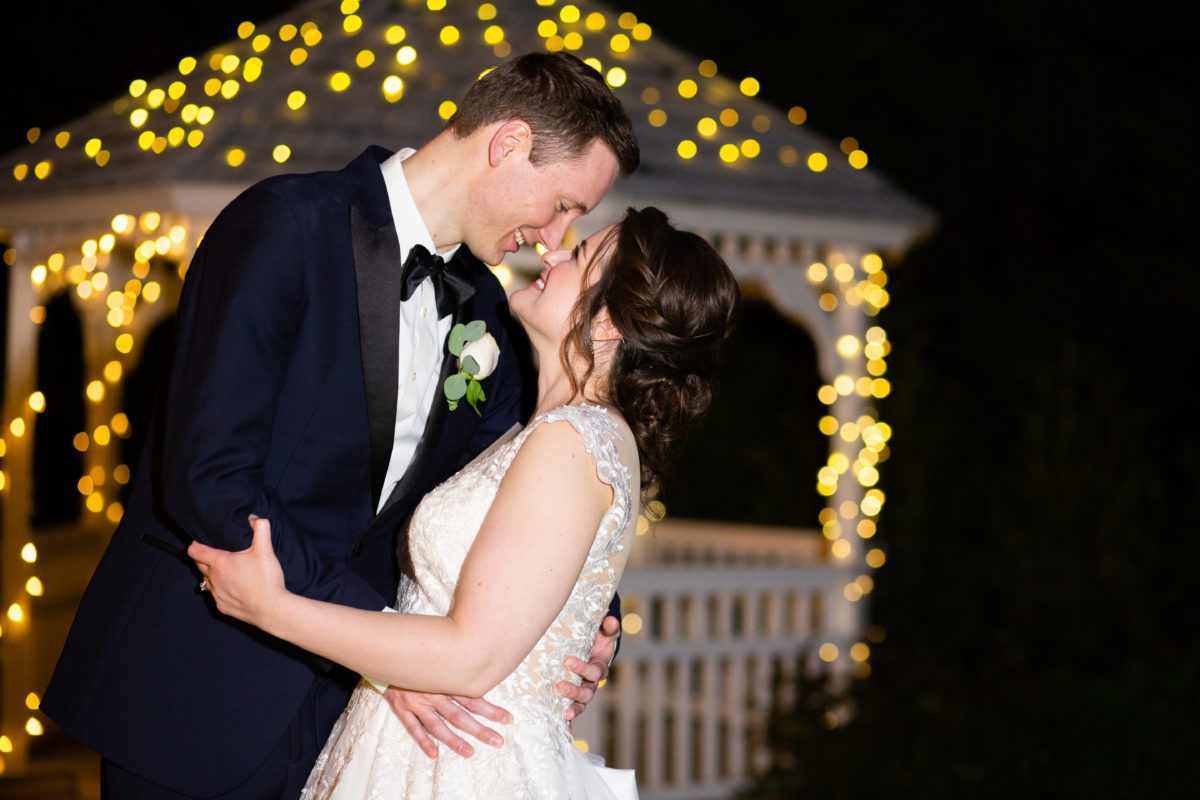 Bride and Groom in front of pergola at The Bradford Estate